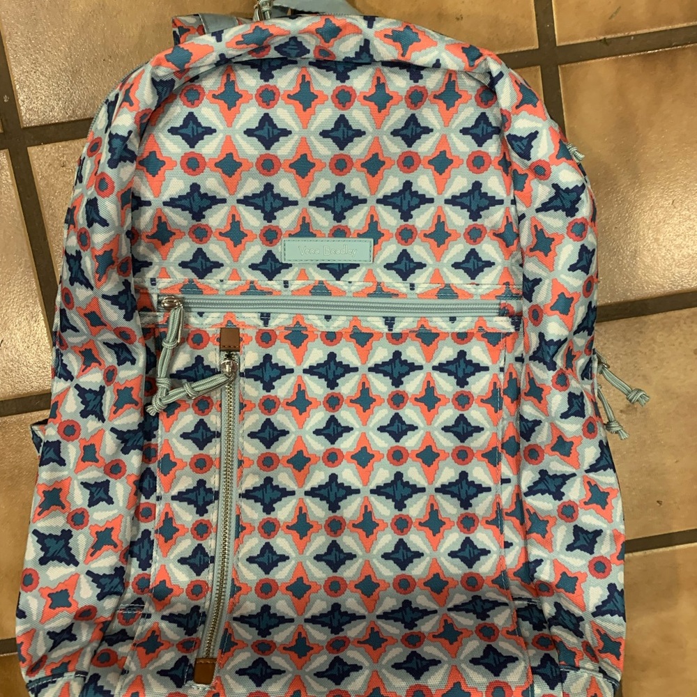 Vera Bradley rolling back pack has a burn on strap